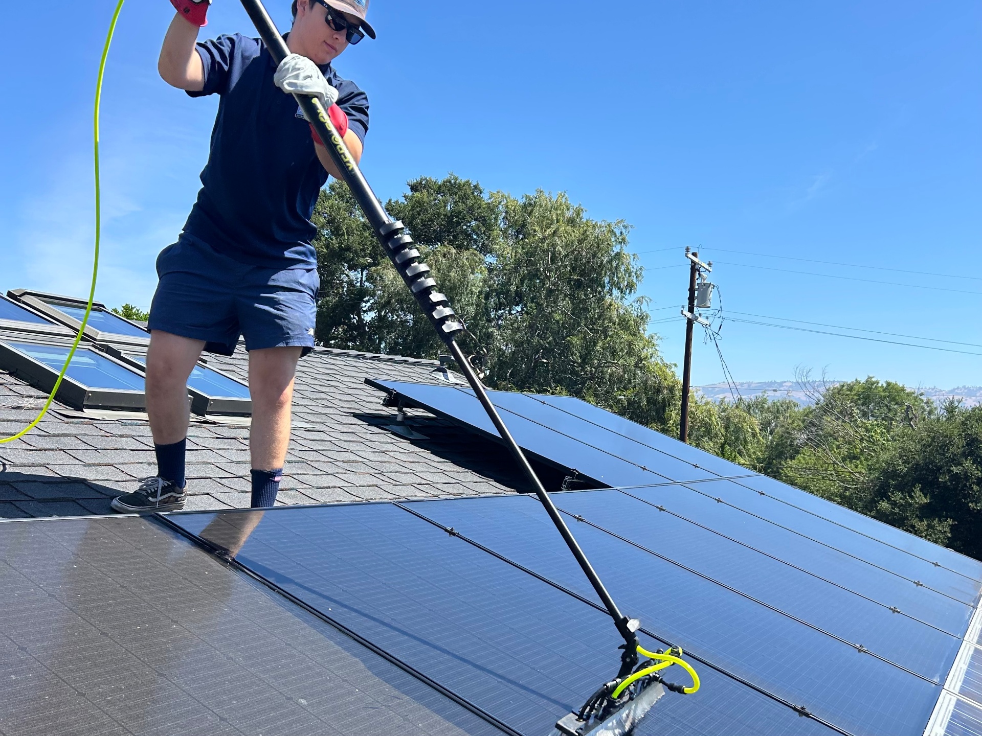 Solar panel cleaning on a residential roof