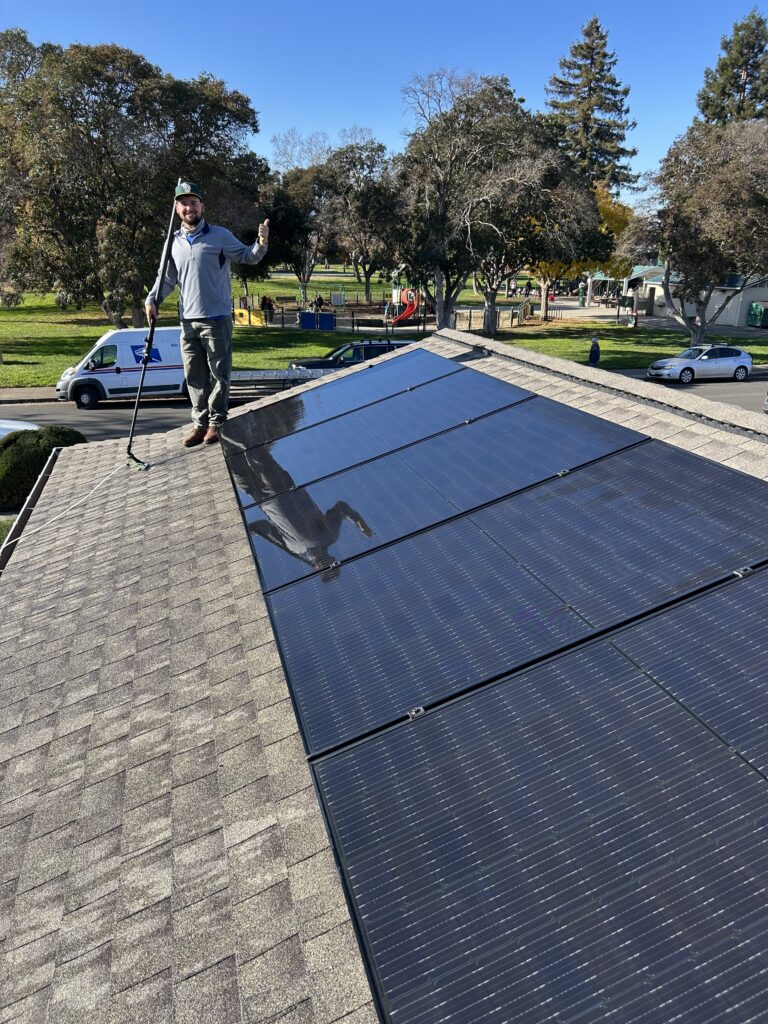 Thumbs up while solar panel cleaning in Willow Glen